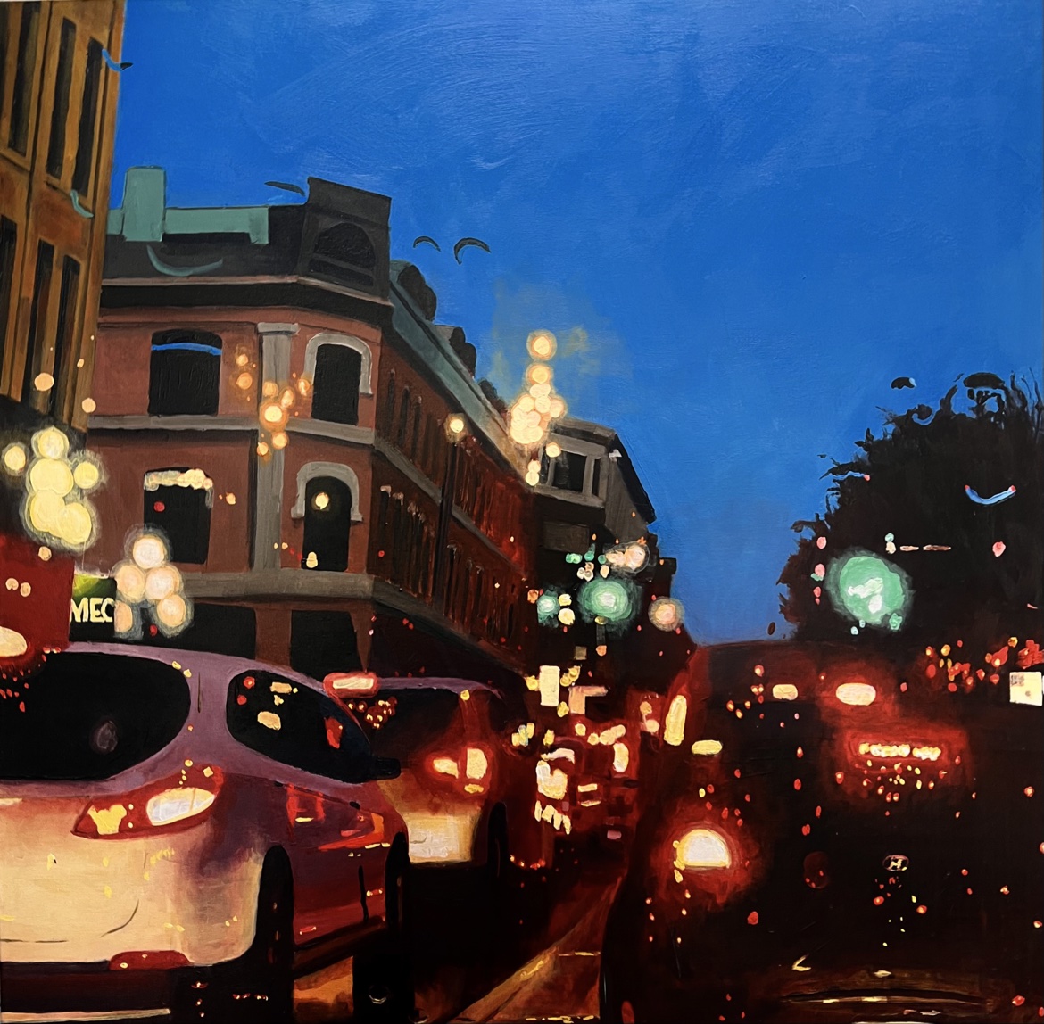 Know Your Place by Jonathan Gleed, a night street scene with cars, glowing city lights and brick buildings beneath a deep blue sky